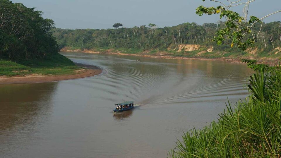 A boat with tourists through the river