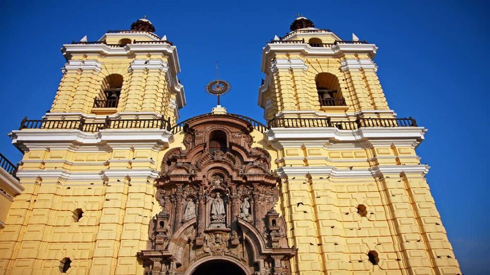 Pale yellow painted cathedral in Lima, viewed from below