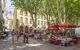 pretty town square with market stalls selling food