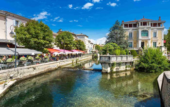 the pretty town of L'Isle-sur-la-Sorgue in provence, canal and restaurants
