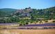 Fields of lavender before a hilltop village