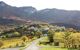 Landscape photo of vineyards and small village with hills behind