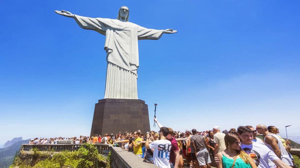 Tourists gathered at the base of the Christ on the viewing platform