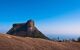 Mountain in front of blue skyline