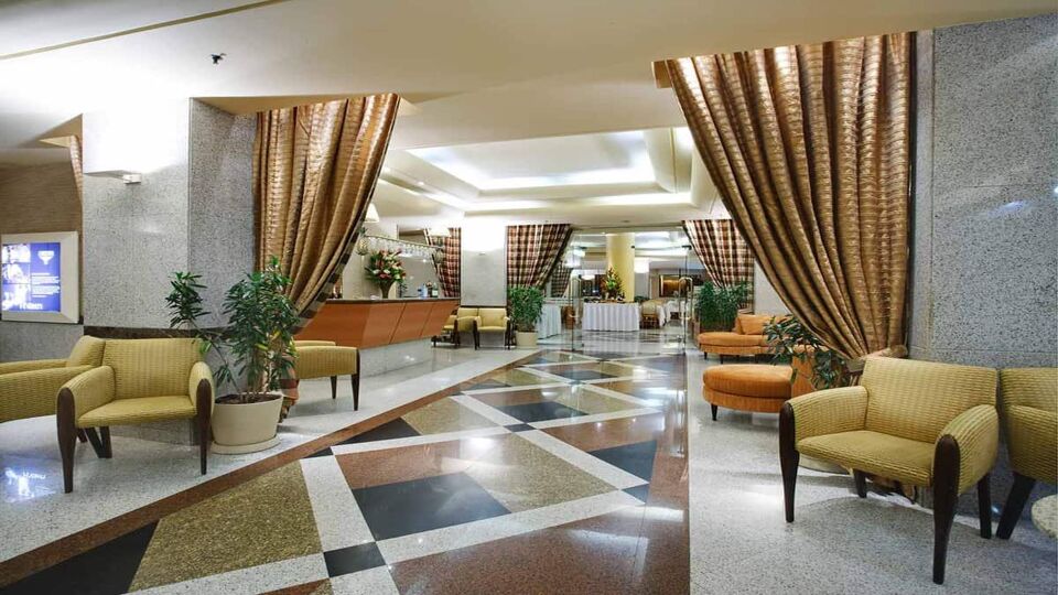 Hotel lobby area with tables and chairs