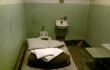 Tiny cell with bed and toilet in Alcatraz prison, San Francisco