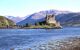 View of the castle on a pinnacle out into the water with hills behind