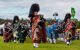 Bagpipe band marching and playing in traditional dress