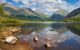 Beautiful lake with green mountains all around