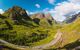 View down a valley to mountains with 3 peaks