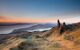 Stunning view of the rust brown landscape with a group of sharp rocks sticking up in the air