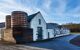 External view of a white distillery building