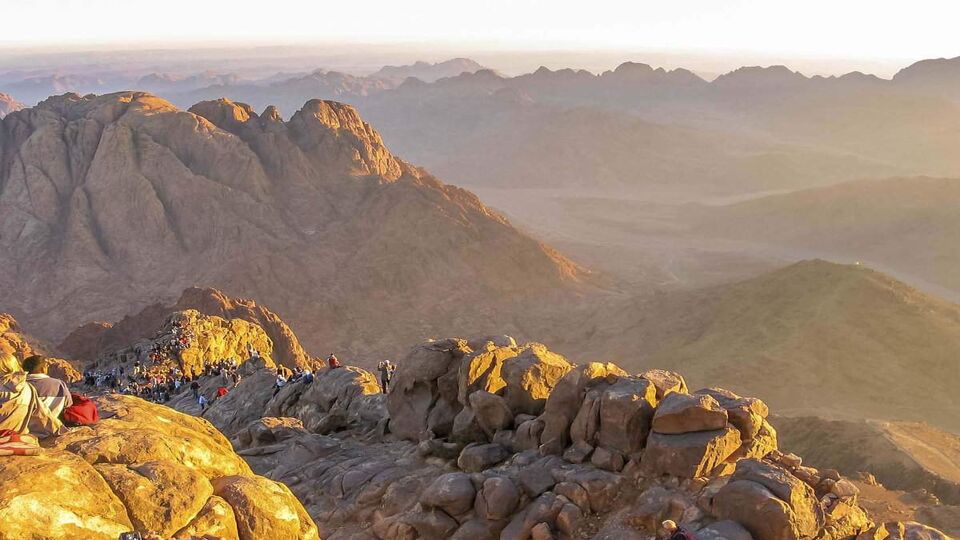 pilgrims waiting for the dawn of the holy summit of Mount Sinai,