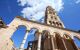 Colonnade in front of large tower