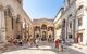 Diocletian's Palace square with tourists in summer morning time