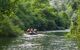 Rafters on a stream in the middle of forest in the Cetina Gorge