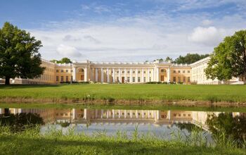 Sweeping yellow palace in front of pond