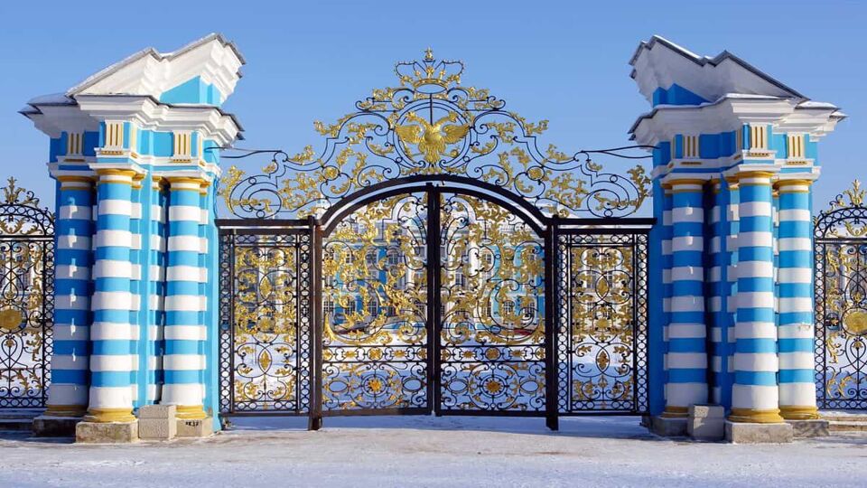 Blue and white striped gates to the palace