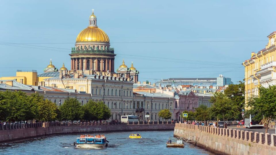 Canal between city buildings with boats