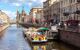 Boats set off on cruise from canal mooring