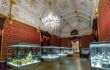 Artefacts lit in cases inside grand hall