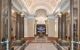 Hallway with columns and vaulted ceiling