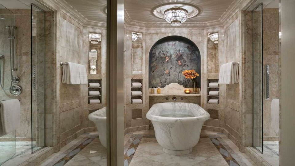 Free standing bath in marble ensuite