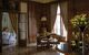 Wood panelled bedroom with french windows