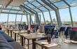 Glass roofed restaurant with views over city