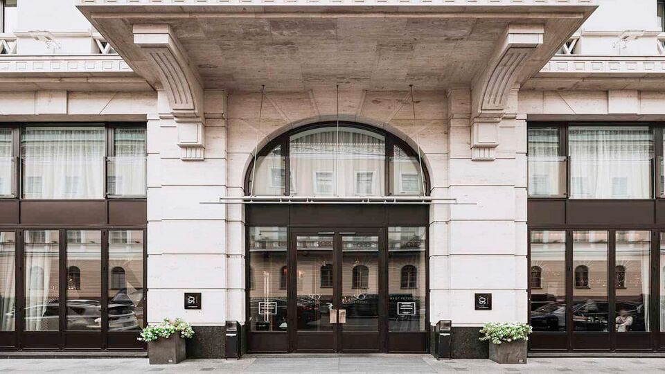 Stone hotel frontage with arched entry