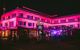 Exterior of Abba Museum lit up pink at night