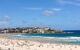 A photo of a busy beach looking out onto a busy beach.