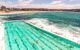 A view from the outdoor pool leading onto the sea.