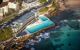 An outdoor pool leading into the sea.