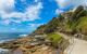 A walkway on the coastline amongst lots of roacks.