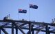 the tip of the bridge with two Australian flags on