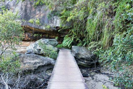 A walkway in a picturesque rocky setting.