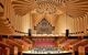 an extravagant, modern, wooden interior of a concert hall