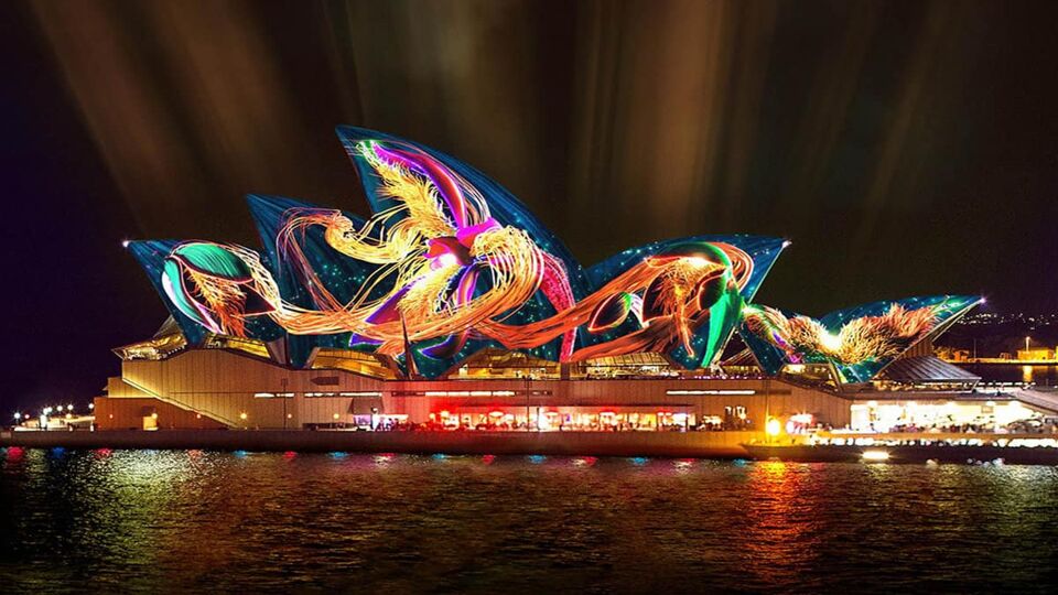 Sydney Opera House with designs lit up on the build roof. Taken at night