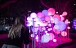 Pink spere lights coming out of the ground at different levels.