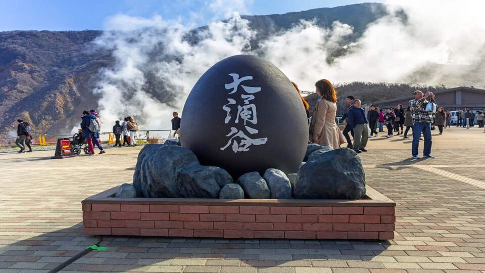Tourists at the volcanic valley of Owakudani in Japan. Owakudani has many active sulphur vents and hot springs in Hakone, Japan.