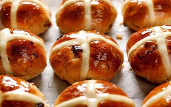 close up of hot cross buns on a tray