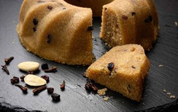 close up of Halva - ground semolina, raisins and almonds boiled with sugar and flavoured with vanilla pods, orange zest and cloves