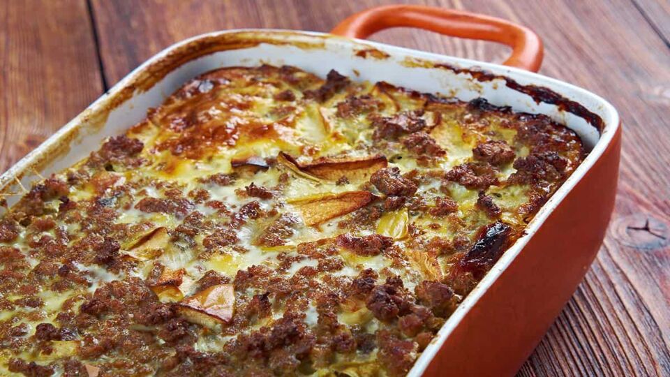 Bobotie also spelt bobotjie, is a South African dish consisting of spiced minced meat baked with an egg-based topping
