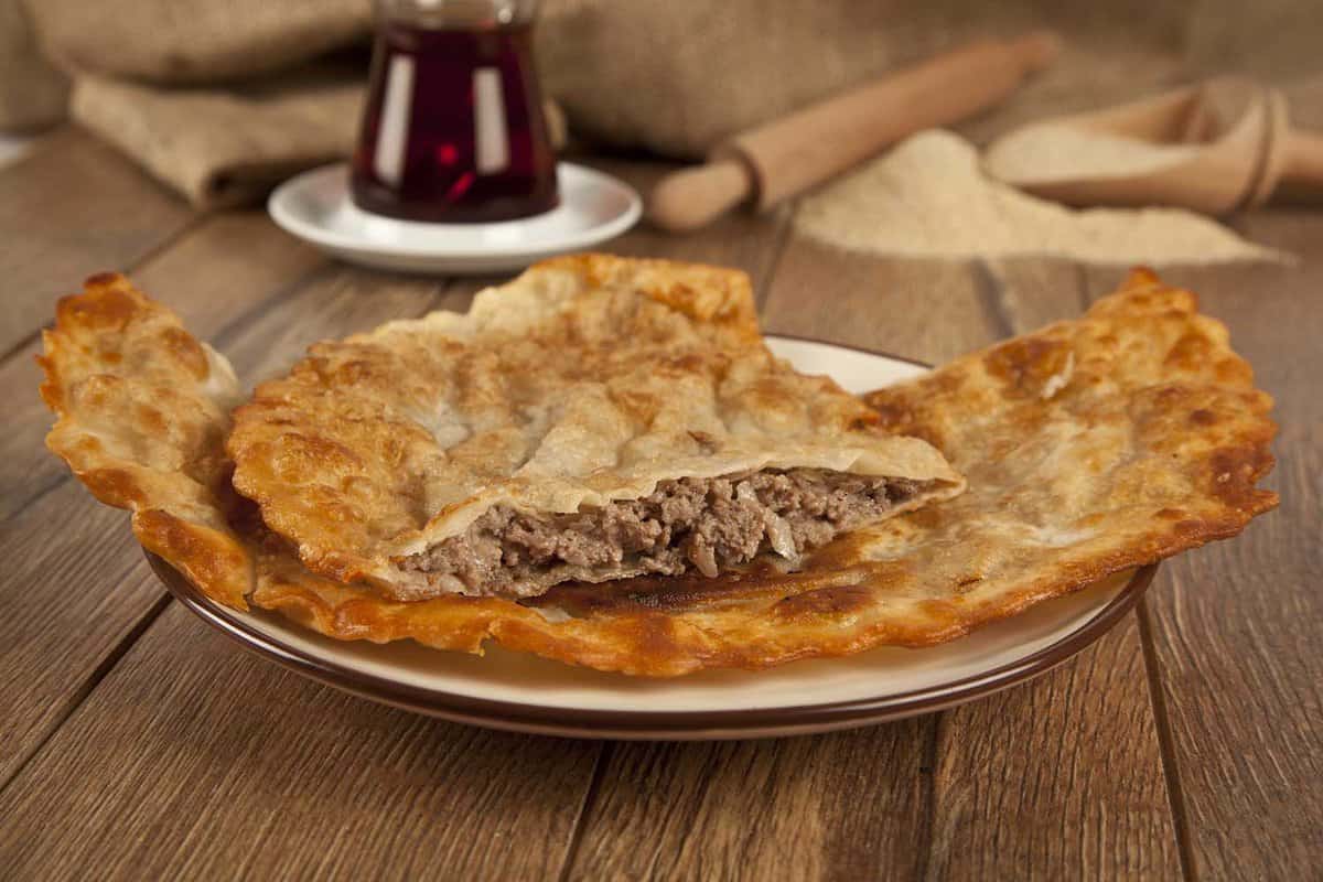 Turkish meat pie fried in oil ( Cig borek - Raw pie or Tatar pie