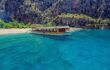 Boat on beautiful aquamarine water as part of a boat tour