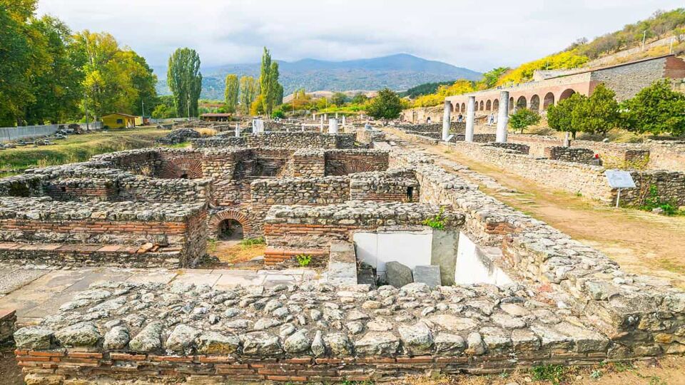 Historical site with ruins of Heraclea, surrounded by mountains