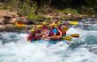 Group of tourists white water rafting on the river