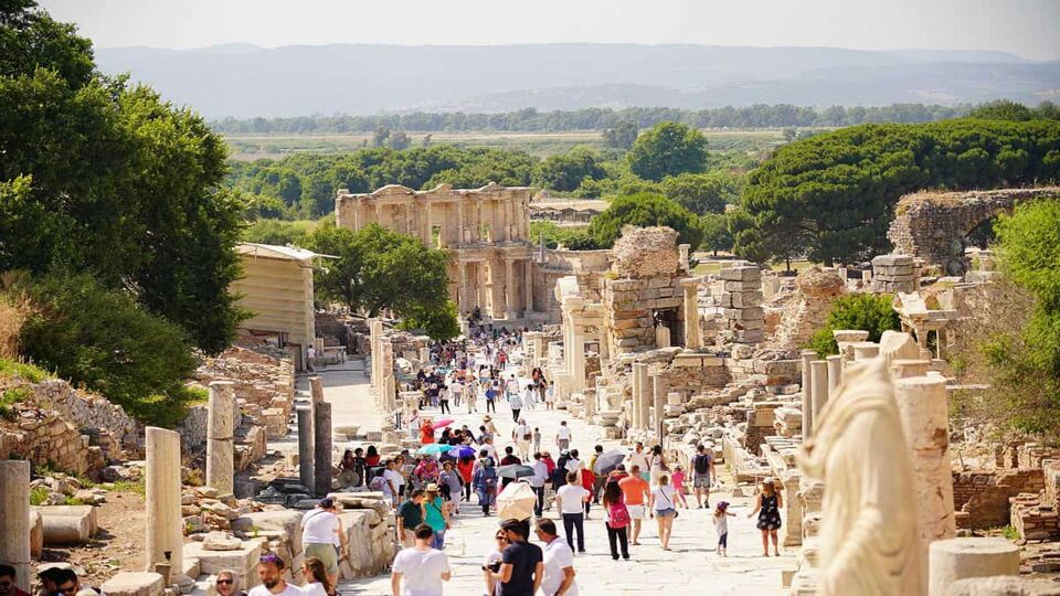 Many tourists wandering the ancient ruins of the city