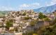 Abandoned houses on a hillside on a sunny day